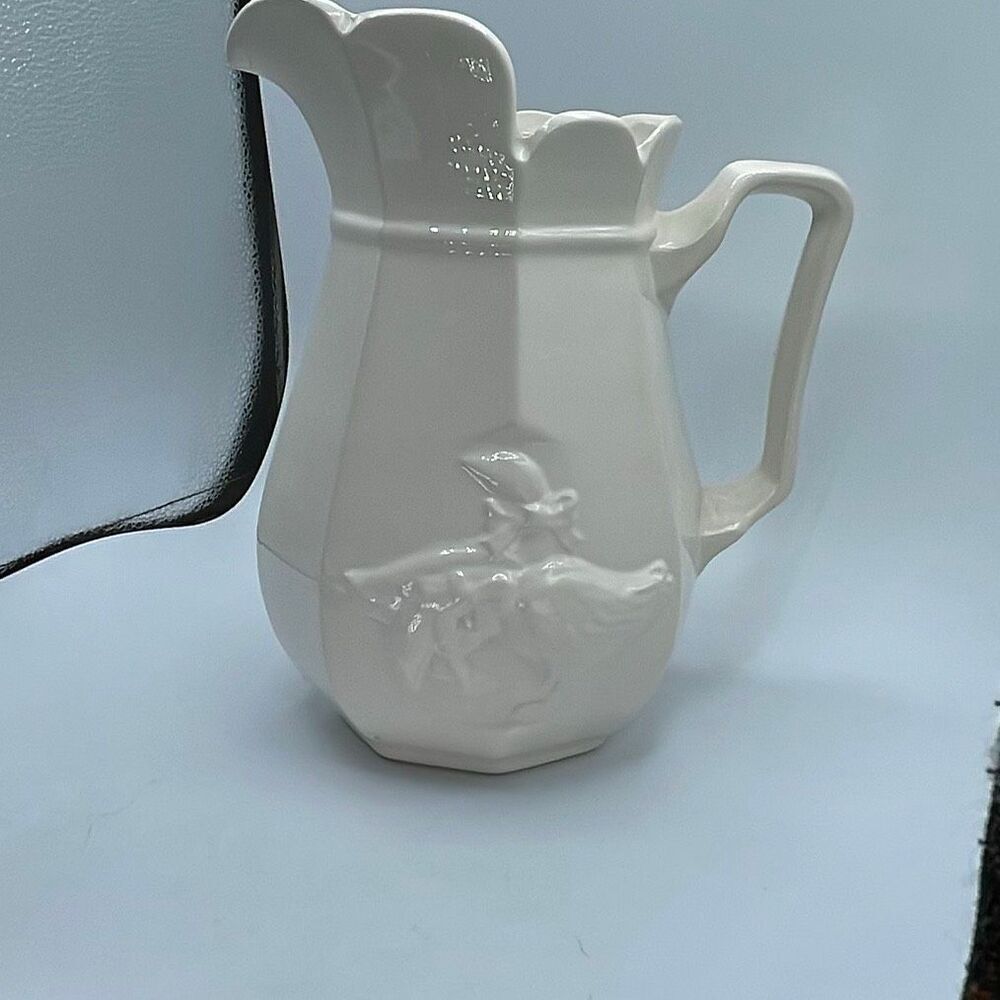 Vintage embossed ceramic country goose pitcher .